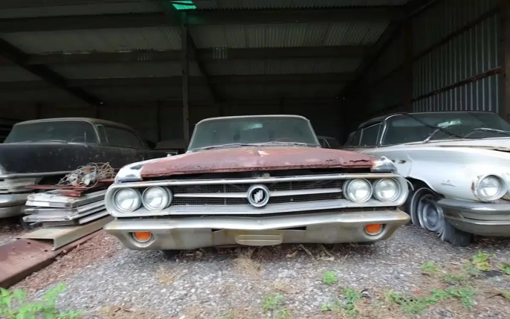 Classic American Muscle Cars Find Shelter In Airplane Hangar